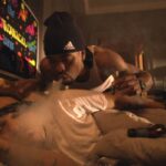 How High 2001 Movie Scene Method Man as Silas blowing marijuana smoke into Redman as Jamal trying to wake him up