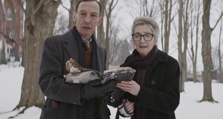 Anything For Jackson 2020 Movie Scene Sheila McCarthy as Audrey and Julian Richings as Henry reading incantations from a satanic book