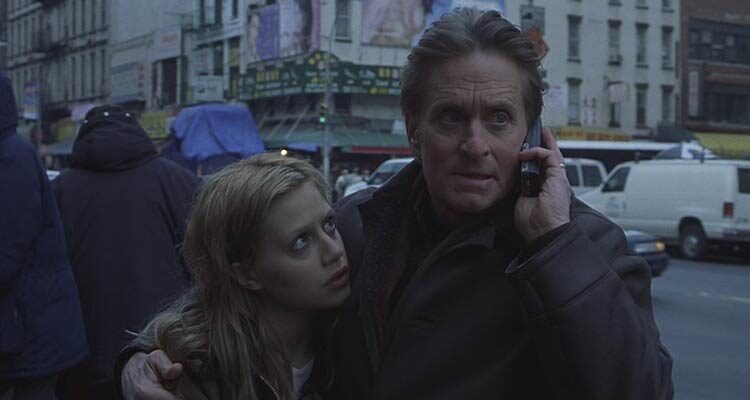 Dont Say A Word 2001 Movie Scene Michael Douglas as Nathan Conrad talking on a mobile phone while holding Brittany Murphy as Elisabeth Burrows