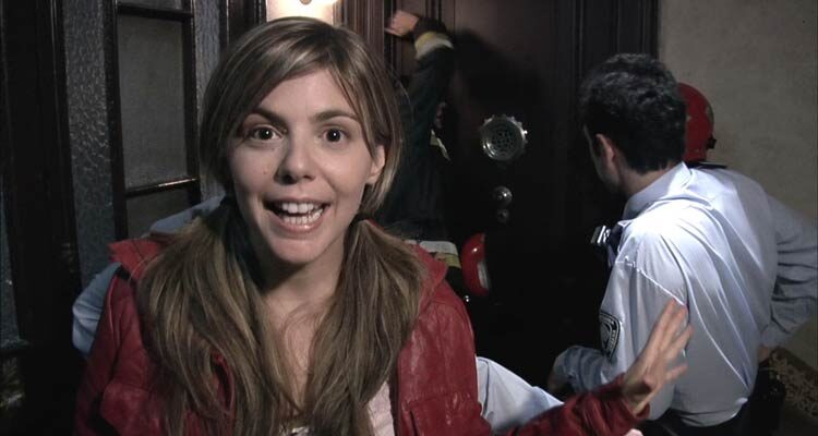 Rec 2007 Movie Scene Manuela Velasco as Angela reporting as the firemen are breaking into the old woman's apartment
