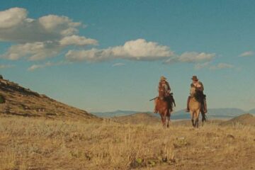 The Ballad of Lefty Brown 2017 Movie Scene Bill Pullman as Lefty Brown and Peter Fonda as Edward Johnson riding into the Montana sunset looking for rustlers who stole their horses