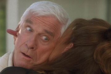 Wrongfully Accused 1998 Movie Scene Kelly LeBrock as Lauren licking Leslie Nielsen as Ryan Harrison's so hard her tongue came out of his other ear