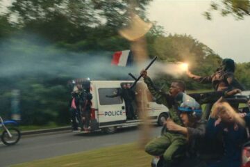 Athena 2022 Movie Scene Rioters driving in a stolen police van heading to their hood
