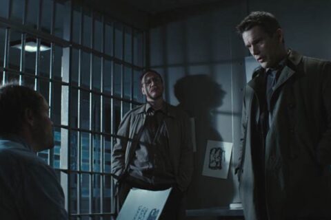 Regression 2015 Movie Scene Ethan Hawke as Bruce Kenner and David Thewlis as Kenneth Raines questioning David Dencik as John Gray in his prison cell