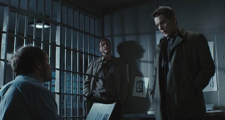 Regression 2015 Movie Scene Ethan Hawke as Bruce Kenner and David Thewlis as Kenneth Raines questioning David Dencik as John Gray in his prison cell