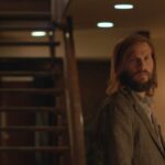 The Invitation 2015 Movie Scene Logan Marshall-Green as Will noticing that something is wrong with this diner party