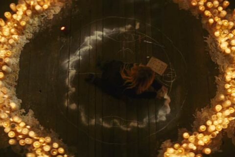 The Skeleton Key 2005 Movie Scene Kate Hudson as Caroline Ellis performing a hoodoo ritual surrounded by candles and salt