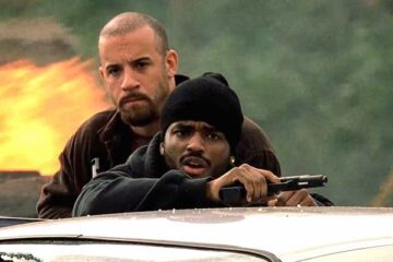 A Man Apart 2003 Movie Scene Vin Diesel as Sean Vetter and Larenz Tate as Demetrius Hicks in the middle of a shootout with cartel members