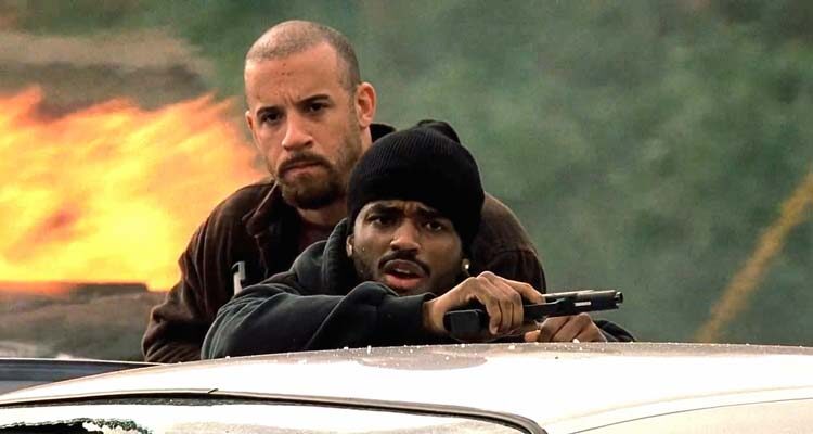 A Man Apart 2003 Movie Scene Vin Diesel as Sean Vetter and Larenz Tate as Demetrius Hicks in the middle of a shootout with cartel members