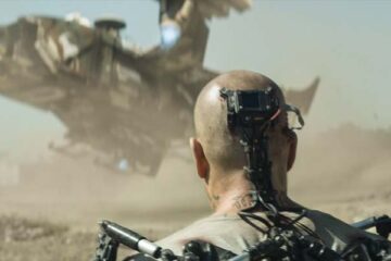 Elysium 2013 Movie Scene Matt Damon as Max wearing an exoskeleton with a special interface plugged directly into his brain walking towards a spaceship landing