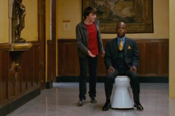 Superhero Movie 2008 Movie Scene Drake Bell as Rick Riker and Tracy Morgan as Professor Xavier who's sitting on a mobile toilet instead of the wheelchair