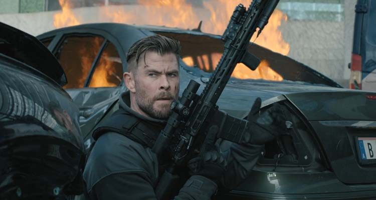Extraction 2 2023 Movie Scene Chris Hemsworth as Tyler Rake reloading his gun
