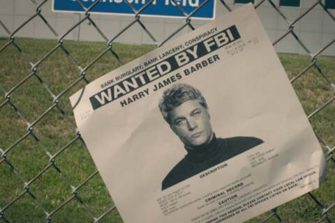Finding Steve McQueen 2019 Movie Scene A wanted FBI flyer with the face of Travis Fimmel as Harry Barber