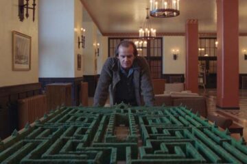 The Shining 1980 Movie Scene Jack Nicholson as Jack Torrance looking at the maze in the lobby of the Overlook Hotel