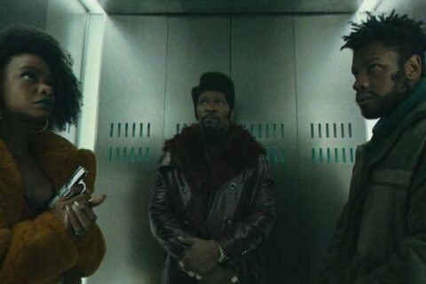 They Cloned Tyrone 2023 Movie Scene John Boyega as Fontaine, Jamie Foxx as Slick Charles, and Teyonah Parris as Yo-Yo in an elevator