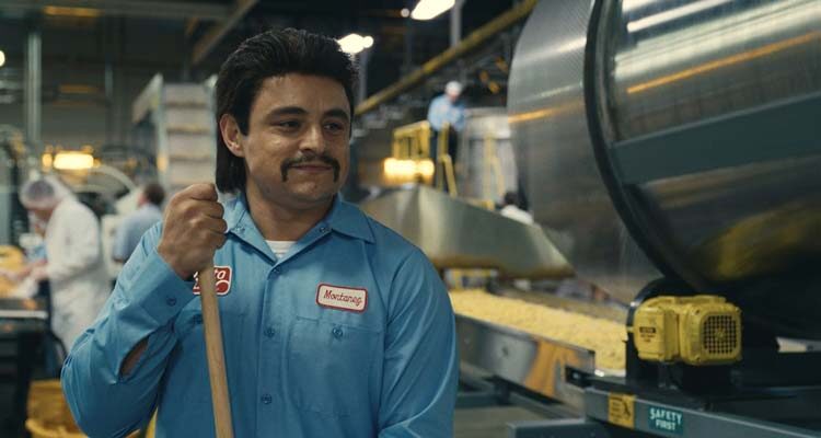Flamin Hot 2023 Movie Scene Jesse Garcia as Richard Montañez working as a janitor at a Frito-Lay factory