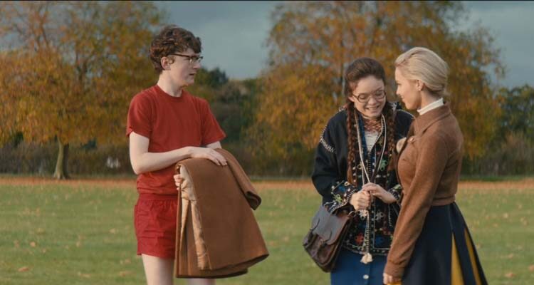 The Bromley Boys 2018 Movie Scene Brenock O'Connor as David Roberts and Savannah Baker as Ruby McQueen with her friend on the football pitch