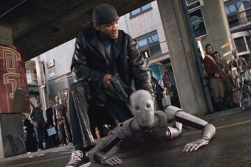I Robot 2004 Movie Scene Will Smith as Del Spooner holding a gun pointed at a robot