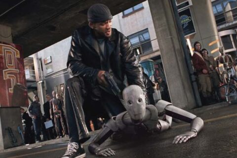 I Robot 2004 Movie Scene Will Smith as Del Spooner holding a gun pointed at a robot