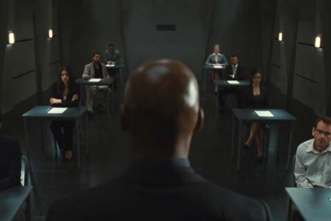 Exam 2009 Movie Scene Colin Salmon as The Invigilator giving instructions to the eight candidates in the room