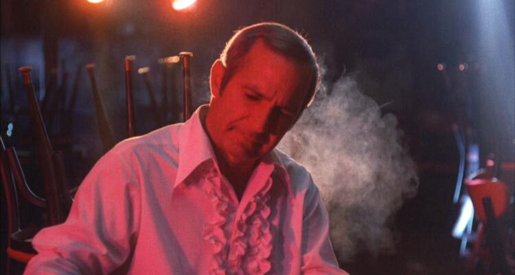 The Killing of a Chinese Bookie 1976 Movie Scene Ben Gazzara as Cosmo Vittelli smoking in his strip club