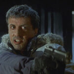 D-Tox 2002 Movie Scene Sylvester Stallone as Jake Malloy holding a gun pointed at the killer