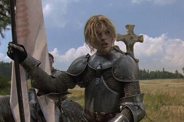 The Messenger The Story of Joan of Arc 1999 Movie Milla Jovovich as Joan of Arc riding a horse in full armor and holding her banner