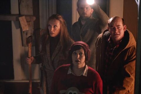 Krampus 2015 Movie Scene Toni Collette as Sarah holding an axe along with Adam Scott as Tom, David Koechner as Howard and Allison Tolman as Linda going to the attic to see what's making the noise