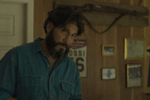 Sweet Virginia 2017 Movie Scene Jon Bernthal as Sam Rossi at the motel reception with a Karabiner 98k rifle hanging in the background