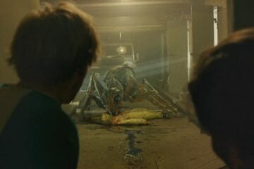 It Came From The Desert 2017 Movie Scene Harry Lister Smith as Brian and Alex Mills as Lukas seeing a giant ant eating a scientist in an underground bunker