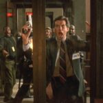 Live Wire 1992 Movie Scene Pierce Brosnan as Danny O'Neill banging on the glass door as the courtroom explodes
