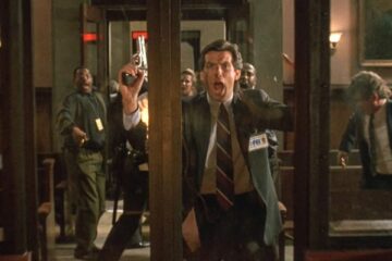 Live Wire 1992 Movie Scene Pierce Brosnan as Danny O'Neill banging on the glass door as the courtroom explodes