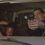 Marked for Death 1990 Movie Scene Steven Seagal as John Hatcher shooting from his vehicle with Keith David as Max ducking to avoid the oncoming fire