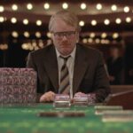Owning Mahowny 2003 Movie Scene Philip Seymour Hoffman as Dan Mahowny a compulsive gambler high roller sitting at a blackjack table