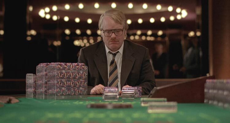 Owning Mahowny 2003 Movie Scene Philip Seymour Hoffman as Dan Mahowny a compulsive gambler high roller sitting at a blackjack table