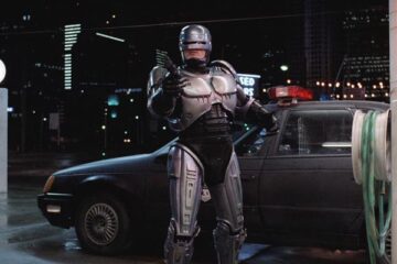 RoboCop 1987 Movie Scene Peter Weller as Alex Murphy exiting his car and holding a gun pointed at the bad guy