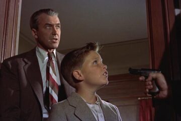 The Man Who Knew Too Much 1956 Movie Scene James Stewart as Dr. Benjamin McKenna and Christopher Olsen as Hank kidnapped at gunpoint