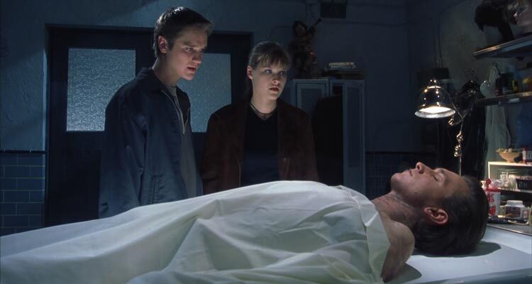 Final Destination 2000 Movie Scene Devon Sawa as Alex and Ali Larter as Clear Rivers in the morgue looking at the dead body of their friend Chad Donella as Tod