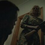 Little Bone Lodge 2023 Movie Scene Joely Richardson as Mama holding a shotgun