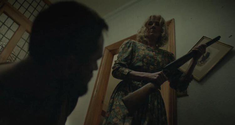 Little Bone Lodge 2023 Movie Scene Joely Richardson as Mama holding a shotgun