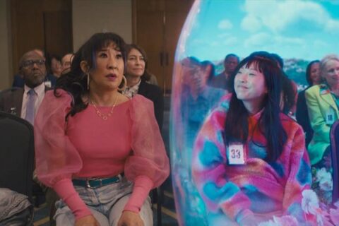 Quiz Lady 2023 Movie Scene Awkwafina as Anne Yum high on drugs while Sandra Oh as Jenny Yum is panicking