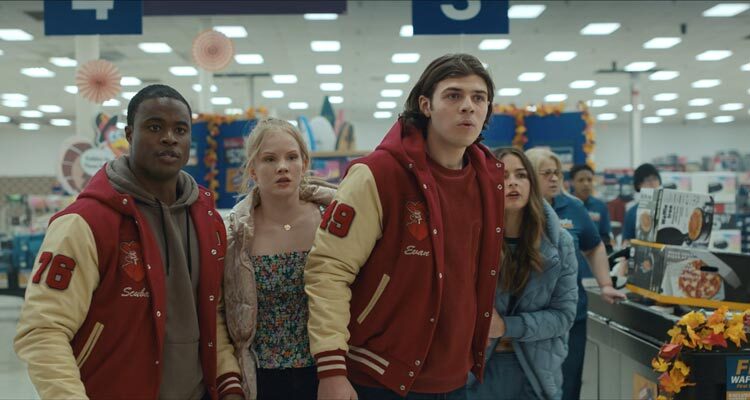 Thanksgiving 2023 Movie Scene Mika Amonsen as Lonnie, Gabriel Davenport as Scuba and the rest of the gang during a black friday sale