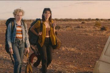 The Royal Hotel 2023 Movie Scene Julia Garner as Hanna and Jessica Henwick as Liv arriving at the place for the first time