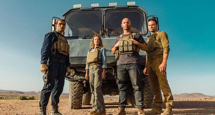 Le salaire de la peur AKA The Wages of Fear 2024 Remake Cast of the movie standing on front of the truck Franck Gastambide, Alban Lenoir, Ana Girardot, and Sofiane Zermani