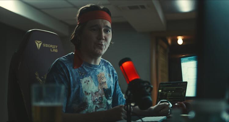 Dumb Money 2023 Movie Scene Paul Dano as Keith Gill AKA Roaring Kitty during his podcasts about the GameStop stock options and short squeeze