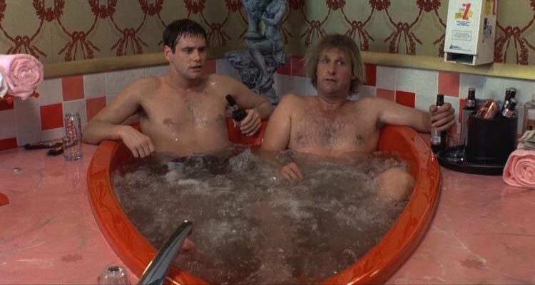 Dumb and Dumber 1994 Movie Scene Jeff Daniels as Harry and Jim Carrey as Lloyd in a heart shaped tub in a motel
