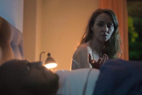 Loving Adults 2022 Movie Scene Sonja Richter as Leonora asking her husband Dar Salim as Christian to see his phone