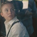 Reality 2023 Movie Scene Sydney Sweeney as Reality Winner in her car surprised by the two FBI agents
