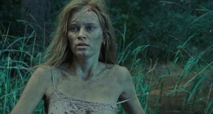 The Last House On The Left 2009 Movie Scene Sara Paxton as Mari running away from their attackers in the woods