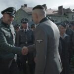 The Zone Of Interest 2023 Movie Scene Nazi's working at Auschwitz congratulating Christian Friedel as Rudolf Höss's birthday